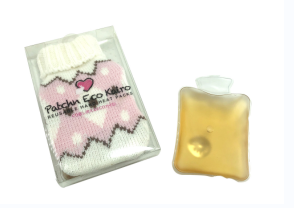 Hot water bottle shaped instant hot pack with woolly sleeve